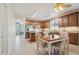 Open kitchen featuring stainless steel appliances, wood cabinets, and an adjacent dining area at 18430 E Azul Ct, Gold Canyon, AZ 85118