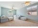 Bright living room with carpet flooring, comfortable seating, and arched window at 18430 E Azul Ct, Gold Canyon, AZ 85118