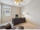 A cozy home office area featuring a desk by the window and a ceiling fan at 18430 E Azul Ct, Gold Canyon, AZ 85118