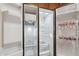 Interior view of stainless steel refrigerator with shelving and water bottles at 18430 E Azul Ct, Gold Canyon, AZ 85118