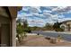 Charming street view features desert landscape and a glimpse of the inviting Entrada del Oro community and mountain views at 18430 E Azul Ct, Gold Canyon, AZ 85118