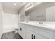 Bright bathroom featuring a dual vanity, modern fixtures, and a shower-tub combination at 2023 S 106Th Ave, Tolleson, AZ 85353