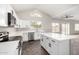 Modern kitchen with white cabinets, stainless steel appliances, and marble floors at 2023 S 106Th Ave, Tolleson, AZ 85353