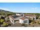 Aerial view of the back of the home showing a covered patio and solar panels at 20701 W Minnezona Ave, Buckeye, AZ 85396