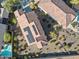 Aerial shot of home shows the solar panels and pool and is surrounded by desert landscaping at 20701 W Minnezona Ave, Buckeye, AZ 85396