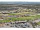 Wide aerial shot of a golf course community featuring desert landscaping at 20701 W Minnezona Ave, Buckeye, AZ 85396