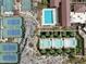 Aerial image of a community with pools, tennis courts, and lush landscaping at 20701 W Minnezona Ave, Buckeye, AZ 85396