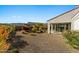 Spacious backyard with desert landscaping featuring a covered patio and gravel groundcover at 20701 W Minnezona Ave, Buckeye, AZ 85396