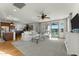 Open concept living room featuring hardwood floors and abundant natural light at 20701 W Minnezona Ave, Buckeye, AZ 85396