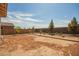 Large backyard with fresh landscaping and privacy fence at 21295 E Estrella Rd, Queen Creek, AZ 85142