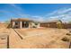 Large backyard with fresh landscaping and patio at 21295 E Estrella Rd, Queen Creek, AZ 85142