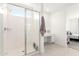 Shower and vanity area of modern bathroom featuring a glass enclosed shower and neutral finishes at 21295 E Estrella Rd, Queen Creek, AZ 85142