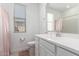 Bathroom with white cabinets, neutral walls, tile flooring and a shower/bath combo at 21295 E Estrella Rd, Queen Creek, AZ 85142