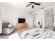 Bright bedroom featuring neutral walls, carpet flooring, a sitting area and closet leading to bathroom at 21295 E Estrella Rd, Queen Creek, AZ 85142