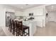 Modern kitchen featuring stainless steel appliances, a large island, and white cabinets at 21295 E Estrella Rd, Queen Creek, AZ 85142