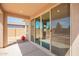 Covered patio with sliding glass doors leading to the backyard at 21295 E Estrella Rd, Queen Creek, AZ 85142