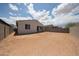 Spacious backyard with block fence, providing privacy and ample space at 2570 E Music Mountain Ave, Apache Junction, AZ 85119