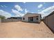Spacious backyard with block fence, providing privacy and ample space at 2570 E Music Mountain Ave, Apache Junction, AZ 85119
