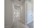 Neutral hallway showcasing recessed lighting and multiple white doors leading to various rooms at 2570 E Music Mountain Ave, Apache Junction, AZ 85119