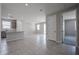 Open layout with a kitchen featuring an island, stainless appliances, and a view of the adjacent living areas at 2570 E Music Mountain Ave, Apache Junction, AZ 85119