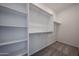 Walk-in closet with white shelves and carpeted floor at 2570 E Music Mountain Ave, Apache Junction, AZ 85119