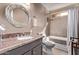 Bathroom with a large mirror above the sink, plus a tub and shower combination at 2890 N 156Th Dr, Goodyear, AZ 85395