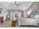 Bright bedroom featuring a ceiling fan and French doors leading to an outdoor space at 2890 N 156Th Dr, Goodyear, AZ 85395