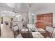 View of the kitchen and dining area with breakfast bar, modern appliances, and open layout at 2890 N 156Th Dr, Goodyear, AZ 85395