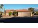 Charming home with a 3-car garage, well-manicured lawn, and mature landscaping at 2890 N 156Th Dr, Goodyear, AZ 85395