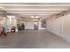 Clean garage with an epoxy floor and lots of storage at 2890 N 156Th Dr, Goodyear, AZ 85395