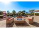 Relaxing pool area with a modern fire pit and comfortable seating at 2890 N 156Th Dr, Goodyear, AZ 85395