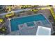 Aerial view of the backyard pool with spa surrounded by desert landscaping at 2890 N 156Th Dr, Goodyear, AZ 85395