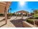 Backyard pool with pergola and a lush landscaped patio area at 2890 N 156Th Dr, Goodyear, AZ 85395