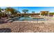 Tranquil pool and spa area surrounded by desert landscaping and a rock border at 2890 N 156Th Dr, Goodyear, AZ 85395