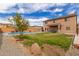 Backyard offers a private pool, landscaped area, and a covered patio for relaxing outdoors at 29767 W Amelia Ave, Buckeye, AZ 85396