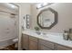 Bathroom with large vanity, modern mirror, and walk in shower at 3116 W Folgers Rd, Phoenix, AZ 85027