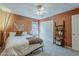 Bedroom with large bed, ceiling fan, and neutral color scheme at 3116 W Folgers Rd, Phoenix, AZ 85027