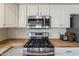 Close up of stainless steel appliances with butcher block counters at 3116 W Folgers Rd, Phoenix, AZ 85027