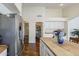 Bright kitchen with butcher block island and stainless steel appliances at 3116 W Folgers Rd, Phoenix, AZ 85027