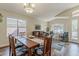 Inviting living area and dining room with hardwood floors, creating a warm and spacious setting for Gathering and guests at 3116 W Folgers Rd, Phoenix, AZ 85027