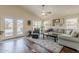 Bright and airy living room with neutral tones, hardwood floors, and access to the backyard at 3116 W Folgers Rd, Phoenix, AZ 85027