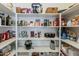 Well-stocked pantry with organized shelving at 3116 W Folgers Rd, Phoenix, AZ 85027