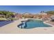 Inviting backyard oasis with a private pool, built-in grill, landscaping, and hanging swing chair at 3116 W Folgers Rd, Phoenix, AZ 85027