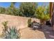 Backyard featuring desert landscaping, a seating area, and a block wall at 32 E Dawn Dr, Tempe, AZ 85284