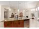 Kitchen island featuring granite countertops, pendant lighting, and a stainless-steel dishwasher at 32 E Dawn Dr, Tempe, AZ 85284