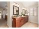 The main bathroom features double sinks with granite countertops and wood cabinets at 32 E Dawn Dr, Tempe, AZ 85284