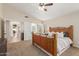 Inviting main bedroom, bright with a ceiling fan, has a door leading to an en suite bathroom at 32 E Dawn Dr, Tempe, AZ 85284