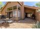 Back patio area with gravel, outdoor furniture, and view of home's exterior at 32 E Dawn Dr, Tempe, AZ 85284