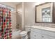 Bathroom featuring shower and tub combo with colorful shower curtain at 3234 N 163Rd Dr, Goodyear, AZ 85395