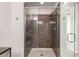 Modern bathroom shower with glass doors and tiled walls at 3234 N 163Rd Dr, Goodyear, AZ 85395